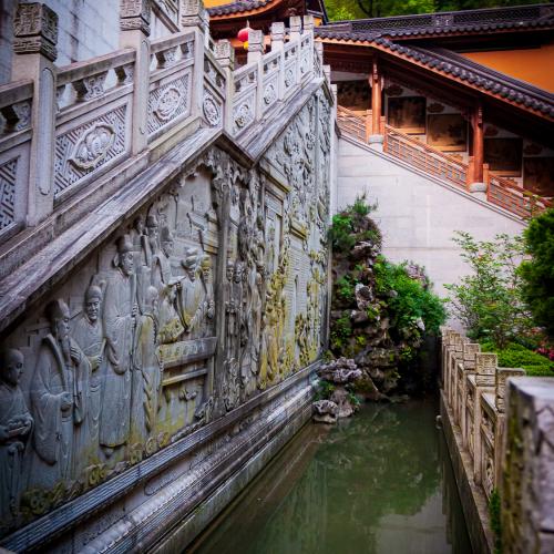 Stair made of stone in a Buddhist temple near Hangzhou with a river near it.